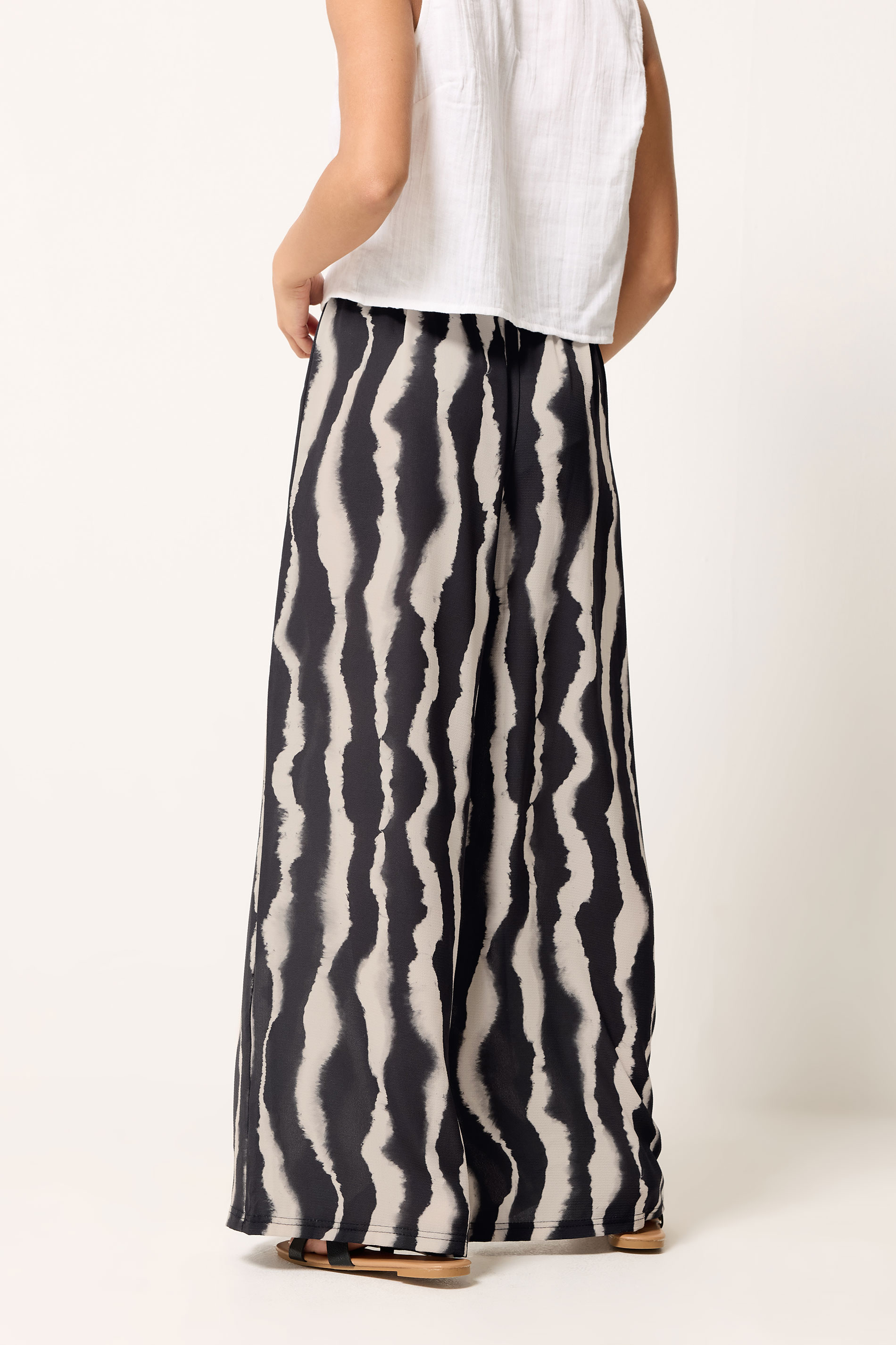 PixieGirl Petite Black Abstract Striped Wide Leg Trousers | PixieGirl 2