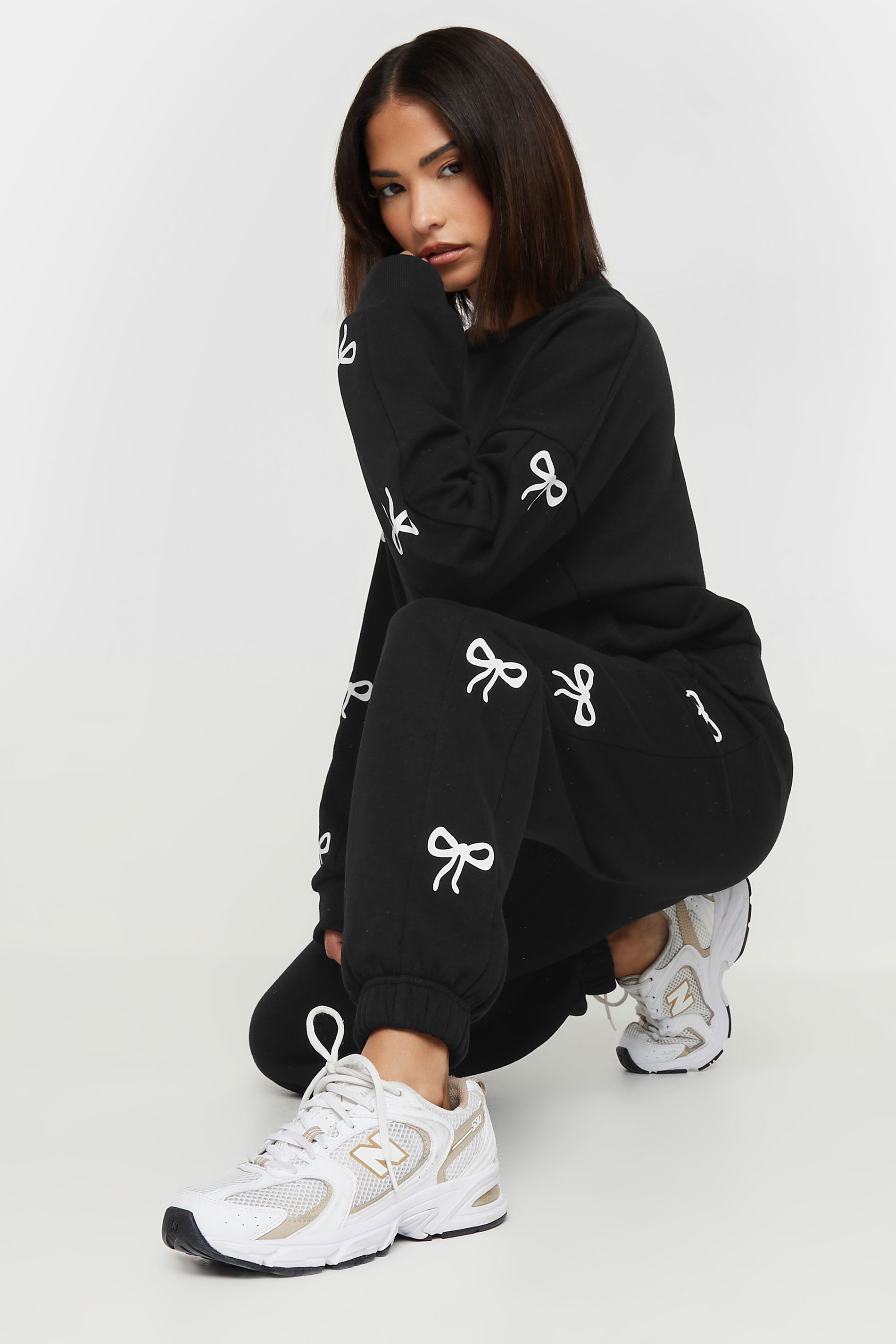 PixieGirl Petite Women's Black Bow Detail Cuffed Joggers | PixieGirl 1