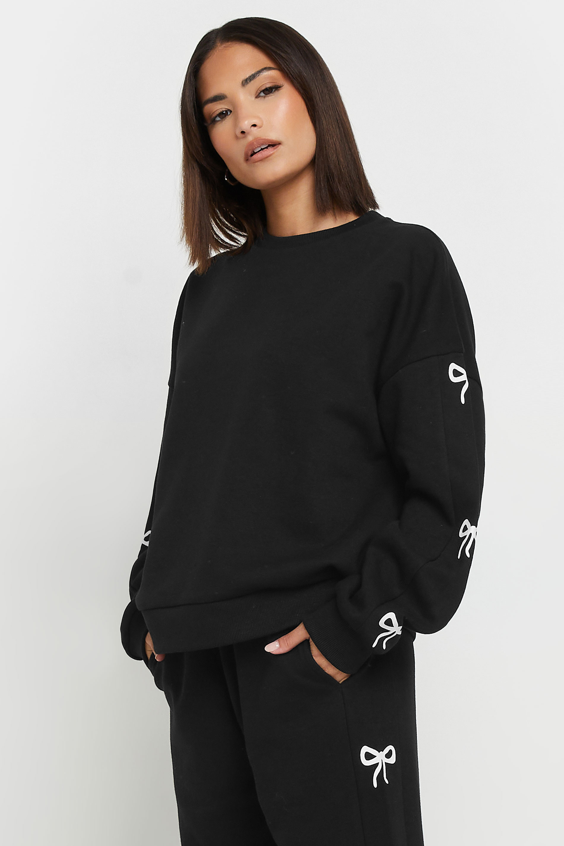 PixieGirl Petite Women's Black Bow Detail Sweatshirt | PixieGirl 1