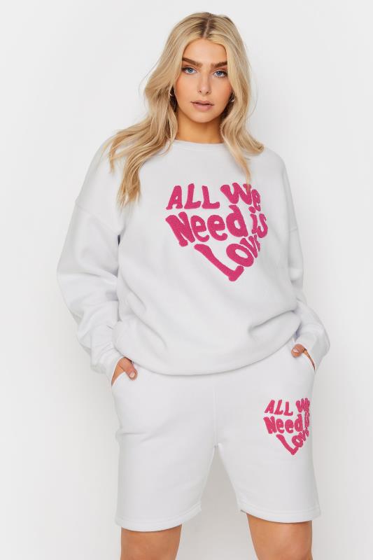 White 'All We Need Is Love' Slogan Jogger Shorts | PixieGirl 1