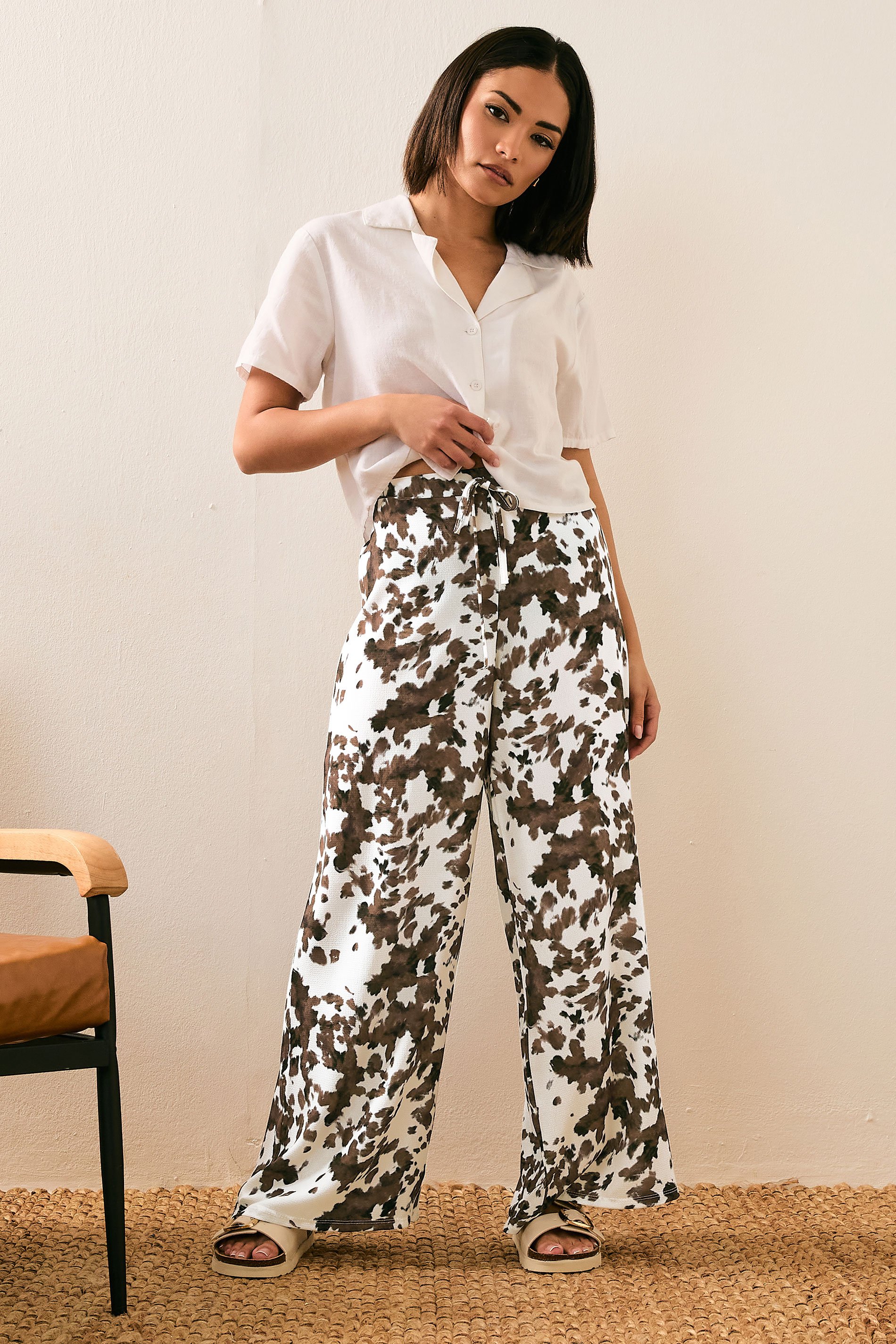 PixieGirl Petite Women's Brown Cow Print Wide Leg Trousers | PixieGirl 1