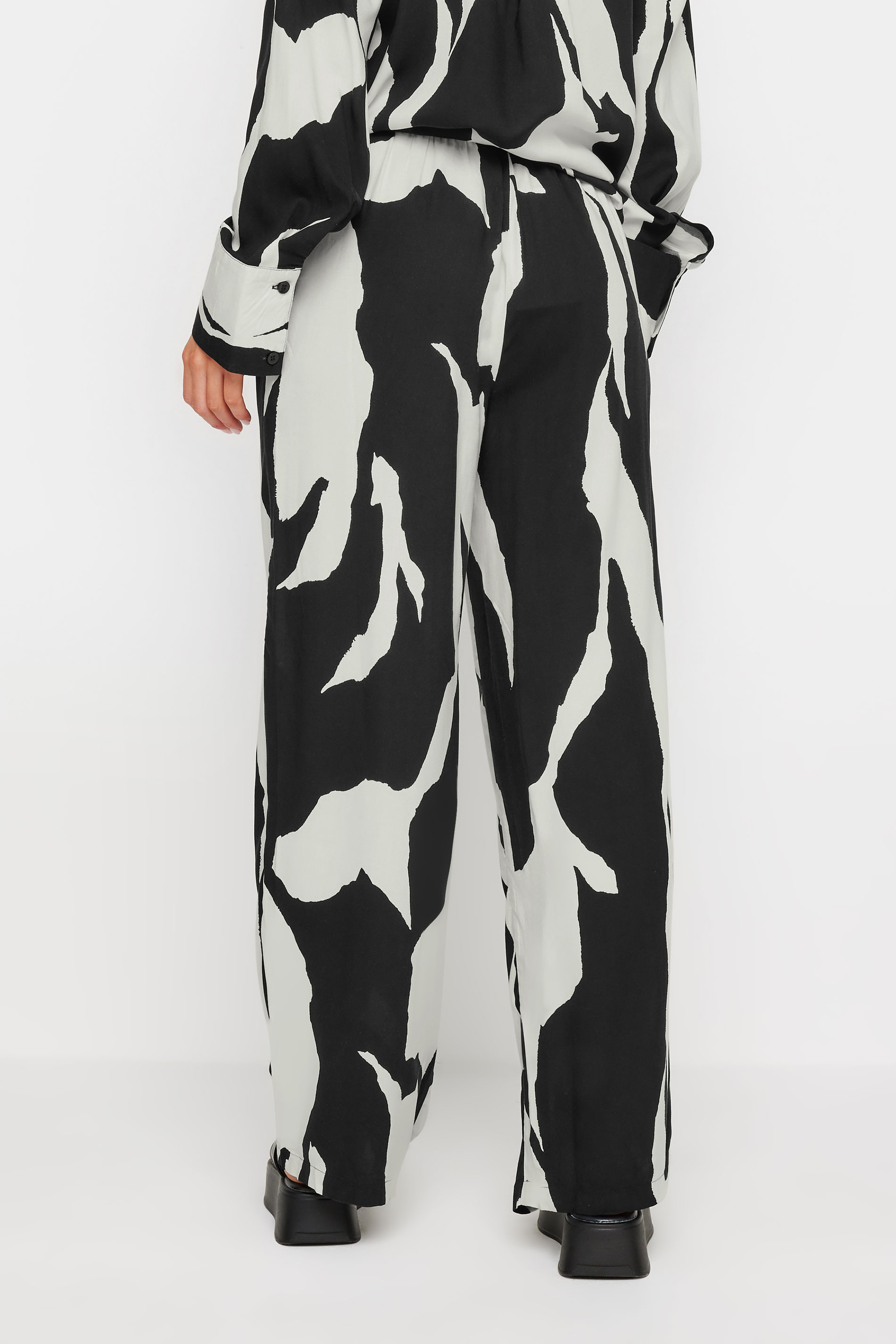 PixieGirl Petite Black Mono Abstract Print Wide Leg Trousers | PixieGirl 3